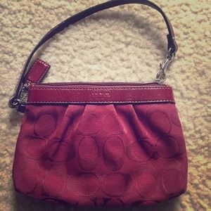 Small wine color Coach purse/wristlet